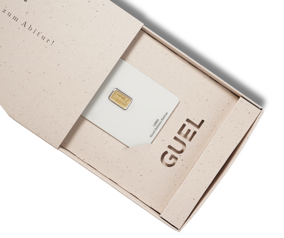 Goldbarren in einer Geschenkbox