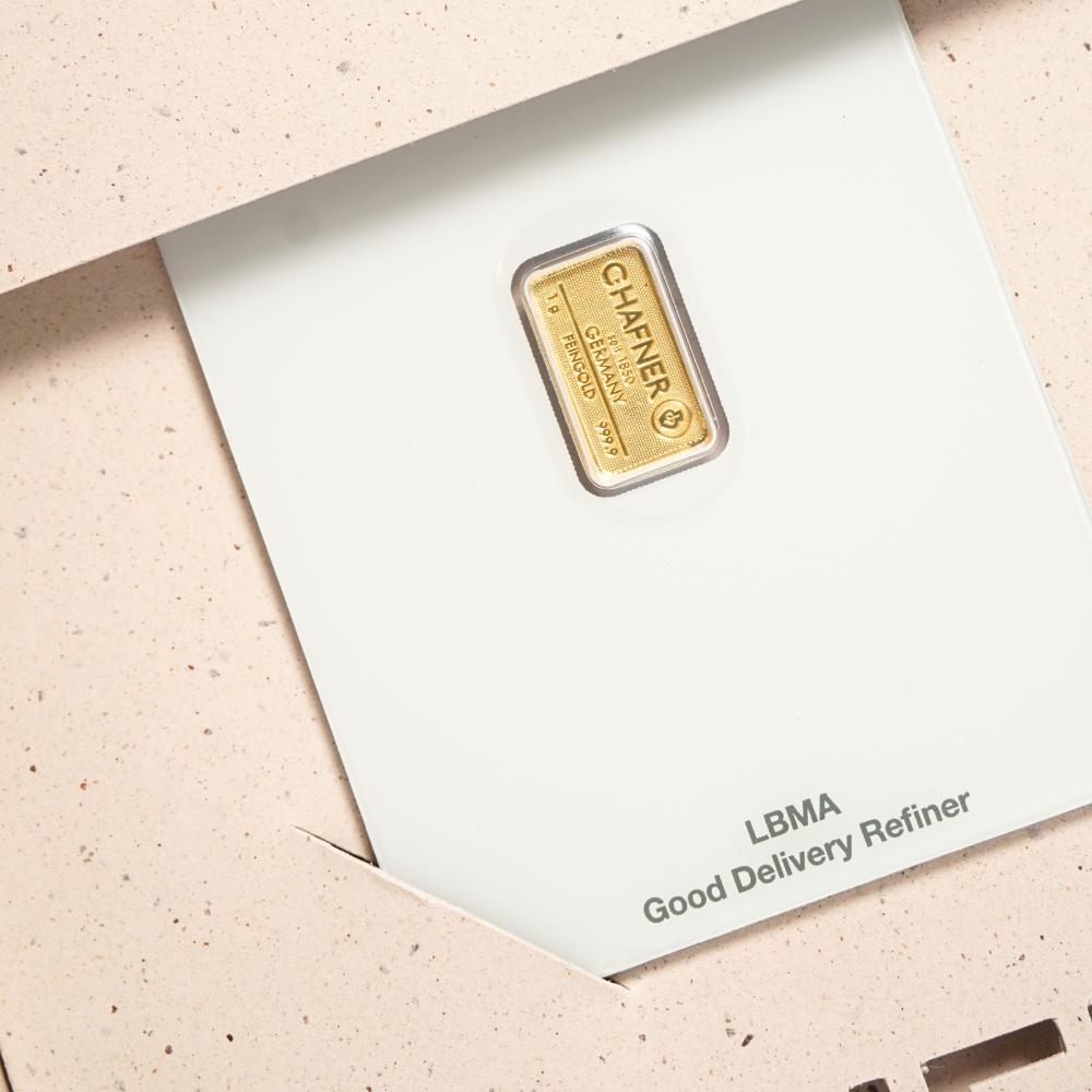 Goldbarren in einer Geschenkbox